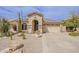Inviting single-story home with desert landscaping, neutral color palette, and attached two-car garage at 29322 N Red Finch Dr, San Tan Valley, AZ 85143