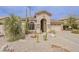 Charming home showcasing stone accents, desert landscaping and a spacious two-car garage at 29322 N Red Finch Dr, San Tan Valley, AZ 85143
