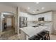 Modern kitchen featuring stainless steel appliances, a spacious island, and stylish countertops and cabinetry at 29322 N Red Finch Dr, San Tan Valley, AZ 85143