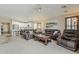 Comfortable living space with an open layout, connecting the kitchen, dining, and lounge areas at 29322 N Red Finch Dr, San Tan Valley, AZ 85143