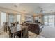 Open-concept living and dining area with natural light, creating a perfect space for gatherings and relaxation at 29322 N Red Finch Dr, San Tan Valley, AZ 85143