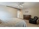 Large carpeted main bedroom features a dresser and chair, offering a relaxing atmosphere at 29322 N Red Finch Dr, San Tan Valley, AZ 85143