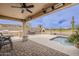 Inviting covered patio with outdoor kitchen and fireplace at 29322 N Red Finch Dr, San Tan Valley, AZ 85143