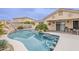 Stunning pool with rock features and swim-up bar at 29322 N Red Finch Dr, San Tan Valley, AZ 85143