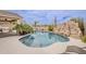 Refreshing pool with built-in rock slide and desert landscaping at 29322 N Red Finch Dr, San Tan Valley, AZ 85143
