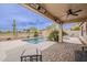 Resort style pool with rock slide and covered patio at 29322 N Red Finch Dr, San Tan Valley, AZ 85143
