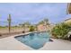 Beautiful backyard pool with a rock slide feature and surrounding landscaping at 29322 N Red Finch Dr, San Tan Valley, AZ 85143