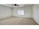 Bedroom with carpet, ceiling fan, and a window with plantation shutters at 2982 E Boston St, Gilbert, AZ 85295