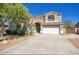 Charming two-story home with a desert landscape, long drive way and a well-maintained lawn at 2982 E Boston St, Gilbert, AZ 85295
