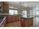 Functional kitchen featuring stainless steel appliances, island, and tile flooring at 2982 E Boston St, Gilbert, AZ 85295