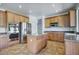 Modern kitchen with stainless steel appliances, island, and maple cabinets at 2982 E Boston St, Gilbert, AZ 85295