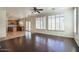 Hardwood living room open to the kitchen and a patio sliding door for easy access at 2982 E Boston St, Gilbert, AZ 85295