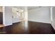 Bright living room showcasing dark hardwood floors, white walls, and staircase at 2982 E Boston St, Gilbert, AZ 85295