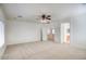 Spacious living room with carpet, ceiling fan, and open access to other rooms at 2982 E Boston St, Gilbert, AZ 85295