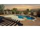 Lush backyard with a pool, rock features and mature landscaping providing backyard privacy at 2982 E Boston St, Gilbert, AZ 85295