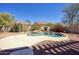 A beautifully landscaped backyard with a refreshing pool, rock waterfall feature and plenty of space at 2982 E Boston St, Gilbert, AZ 85295