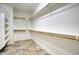 Large walk-in closet with ample shelving and wooden rails at 2982 E Boston St, Gilbert, AZ 85295