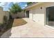 Backyard featuring a small dirt area, paving stones, and cacti at 3023 W Calavar Rd, Phoenix, AZ 85053
