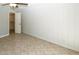 Bedroom with tile flooring and a closet at 3023 W Calavar Rd, Phoenix, AZ 85053