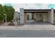 Charming single-story home features a covered parking area and desert landscaping at 3023 W Calavar Rd, Phoenix, AZ 85053