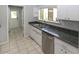 Eat-in kitchen featuring stainless steel appliances, laminate countertops, and tile flooring at 3023 W Calavar Rd, Phoenix, AZ 85053
