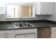 Kitchen sink with stainless steel appliances and fixtures at 3023 W Calavar Rd, Phoenix, AZ 85053