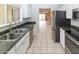 Eat-in kitchen featuring stainless steel appliances and laminate countertops at 3023 W Calavar Rd, Phoenix, AZ 85053