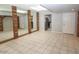 Living room featuring tiled floor and brick accents at 3023 W Calavar Rd, Phoenix, AZ 85053