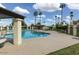 Community swimming pool with nearby lounge area and palm trees at 3023 W Calavar Rd, Phoenix, AZ 85053