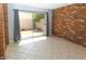 Sunroom with tiled floor and sliding door to the backyard at 3023 W Calavar Rd, Phoenix, AZ 85053