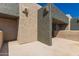 View of an outdoor balcony featuring neutral stucco walls and a sleek, modern design with a concrete patio space at 3030 N Hayden Rd # 16, Scottsdale, AZ 85251