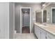Bathroom with tiled floors, single vanity and large mirror at 3030 N Hayden Rd # 16, Scottsdale, AZ 85251