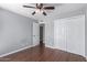Bedroom featuring wood floors, closet and ceiling fan at 3030 N Hayden Rd # 16, Scottsdale, AZ 85251