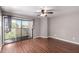 Bedroom featuring sliding glass doors to private balcony and dark wood floors at 3030 N Hayden Rd # 16, Scottsdale, AZ 85251