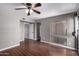 Bedroom features wood flooring, ceiling fan, and neutral paint at 3030 N Hayden Rd # 16, Scottsdale, AZ 85251
