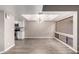 Bright dining room with modern light fixture open to the kitchen at 3030 N Hayden Rd # 16, Scottsdale, AZ 85251