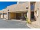 Open garage with a fire pit table sitting in front at 3030 N Hayden Rd # 16, Scottsdale, AZ 85251
