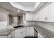Bright kitchen with white cabinetry, granite countertops, and stainless steel appliances at 3030 N Hayden Rd # 16, Scottsdale, AZ 85251