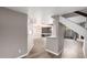 Bright, open-concept living room with wood floors and a modern lighting fixture at 3030 N Hayden Rd # 16, Scottsdale, AZ 85251