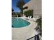 Community pool featuring lounge chairs and a shared outside living space at 3030 N Hayden Rd # 16, Scottsdale, AZ 85251