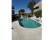 Community pool with clear water, lounge chairs and shaded pergola, great for relaxation at 3030 N Hayden Rd # 16, Scottsdale, AZ 85251