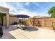 Backyard patio area with a picnic table and desert landscaping at 3343 E Ivanhoe St, Gilbert, AZ 85295