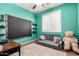 bedroom with a convertible sofa, desk, and chalkboard for creative fun at 3343 E Ivanhoe St, Gilbert, AZ 85295