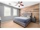 Charming bedroom with accent wall, natural light, and comfortable gray furnishings at 3343 E Ivanhoe St, Gilbert, AZ 85295