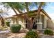 Inviting home with attractive desert landscaping, mature trees and a front porch at 3343 E Ivanhoe St, Gilbert, AZ 85295