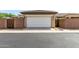 View of a two-car garage with white door and gated entrances at 3343 E Ivanhoe St, Gilbert, AZ 85295