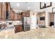 Functional kitchen showcasing stainless steel appliances, granite counters, and ample cabinet space at 3343 E Ivanhoe St, Gilbert, AZ 85295