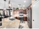 Well-equipped kitchen featuring stainless steel appliances, island, and open access to dining area at 3343 E Ivanhoe St, Gilbert, AZ 85295