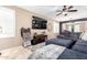 Comfortable living room featuring a large sectional sofa, TV, and stylish decor at 3343 E Ivanhoe St, Gilbert, AZ 85295