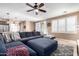 Spacious living room with cozy sectional seating, stylish rug, and neutral decor at 3343 E Ivanhoe St, Gilbert, AZ 85295